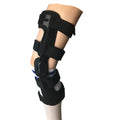 Black anterior ligament knee pad with metal stabiliser showing sandwich construction and sizing options