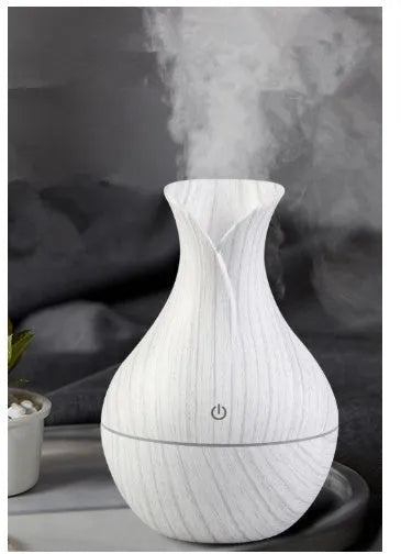 Small vase humidifier with 130ml water tank in Crackle Mahogany finish, USB powered, on a wooden desk