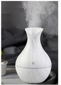 Small vase humidifier with 130ml water tank in Crackle Mahogany finish, USB powered, on a wooden desk