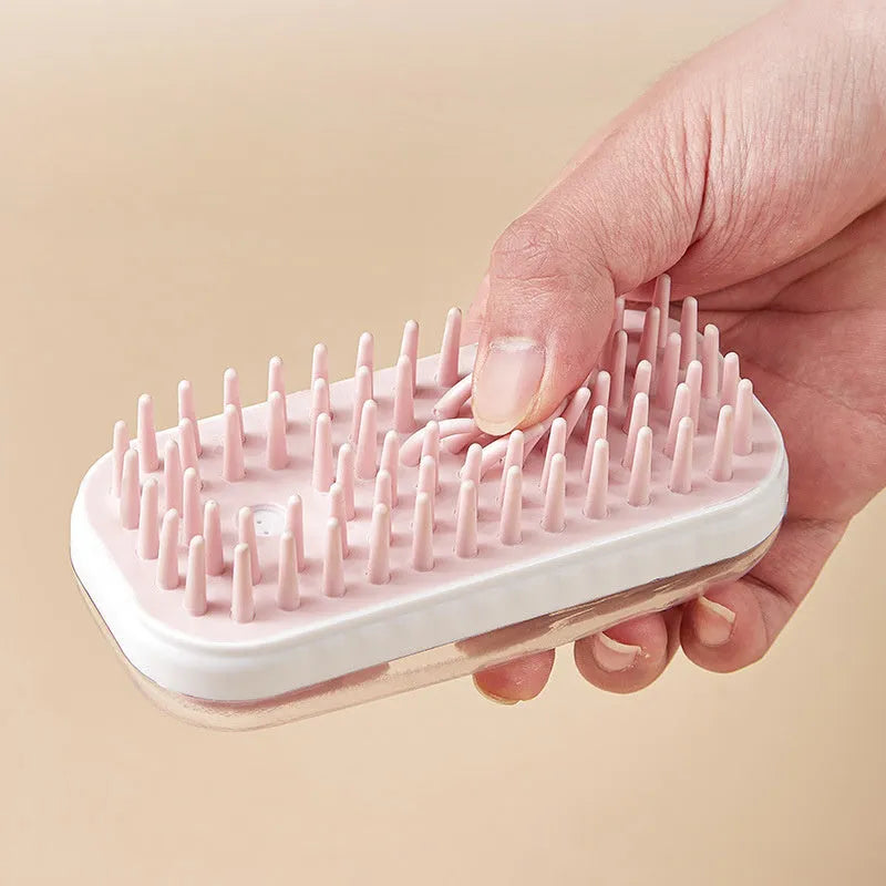 Grey and pink silicone pet bath brush with detachable head for dogs and cats.