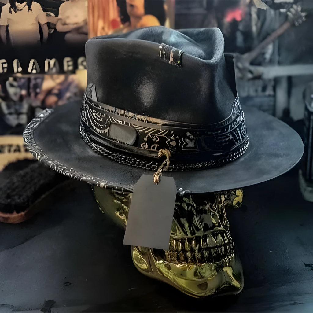 Handmade grey wool felt conical hat with a black embroidered skull design on the front.