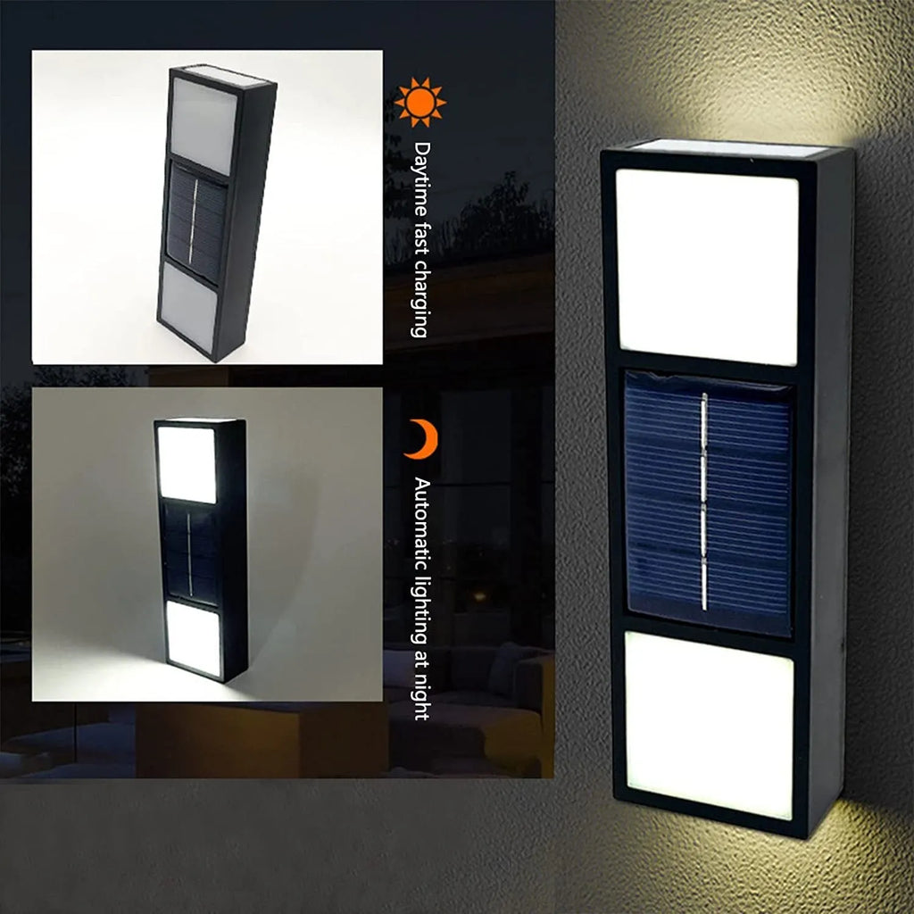 White solar wall lamp with bidirectional sensor mounted on a brick wall, showing warm light illumination