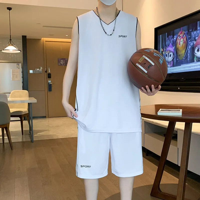 Polyester basketball sports suit with short sleeve vest and matching shorts in various colours