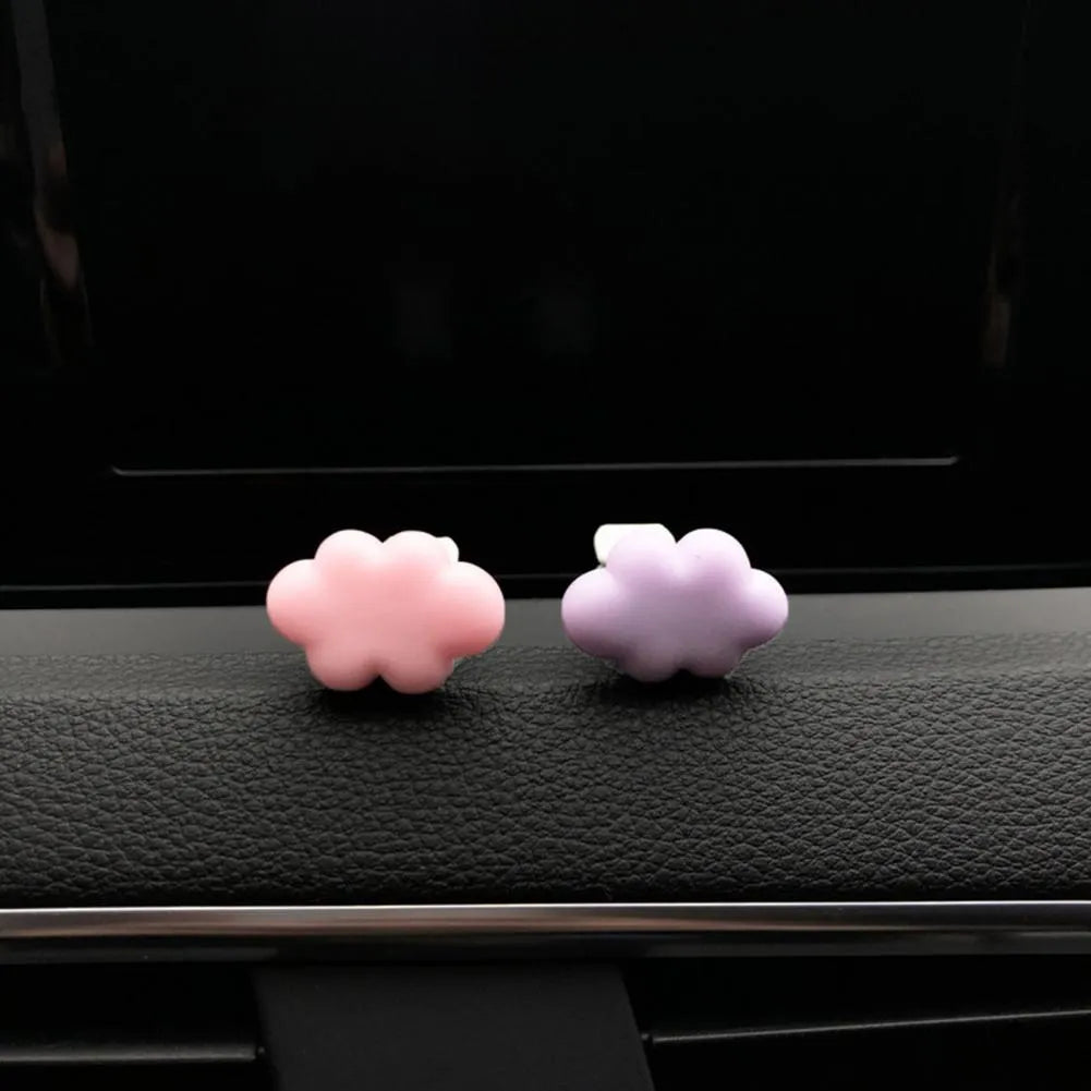 Resin Baiyun cartoon car air freshener clip in pastel colours on a car vent.