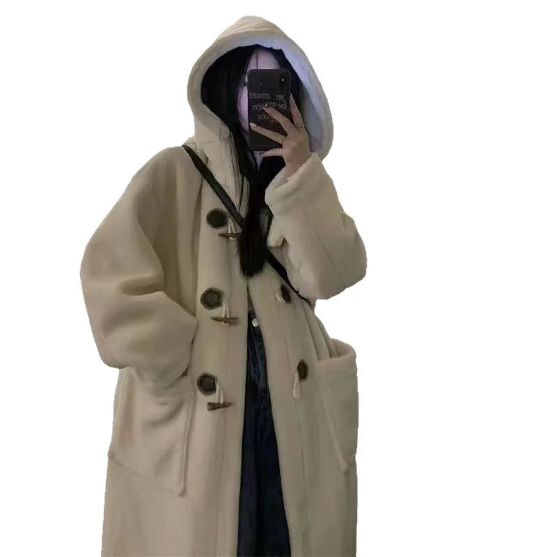 Women's mid-length lamb wool coat in apricot with horn button front closure