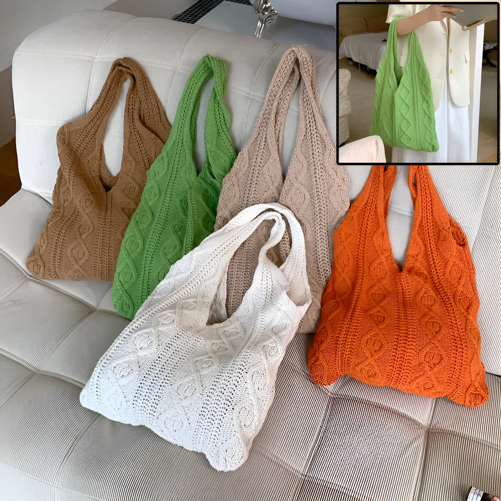Light brown crochet knit tote bag with double shoulder straps on a wooden table.