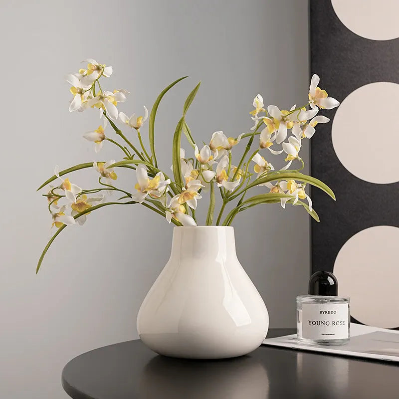 Black ceramic round belly vase with glass surface and coloured glaze decoration