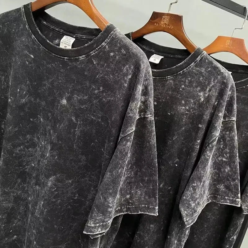 Men's black cotton short-sleeved casual top shown on a plain background