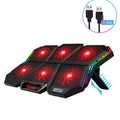 Black and red six-fan laptop cooling pad with USB cable on a desk.