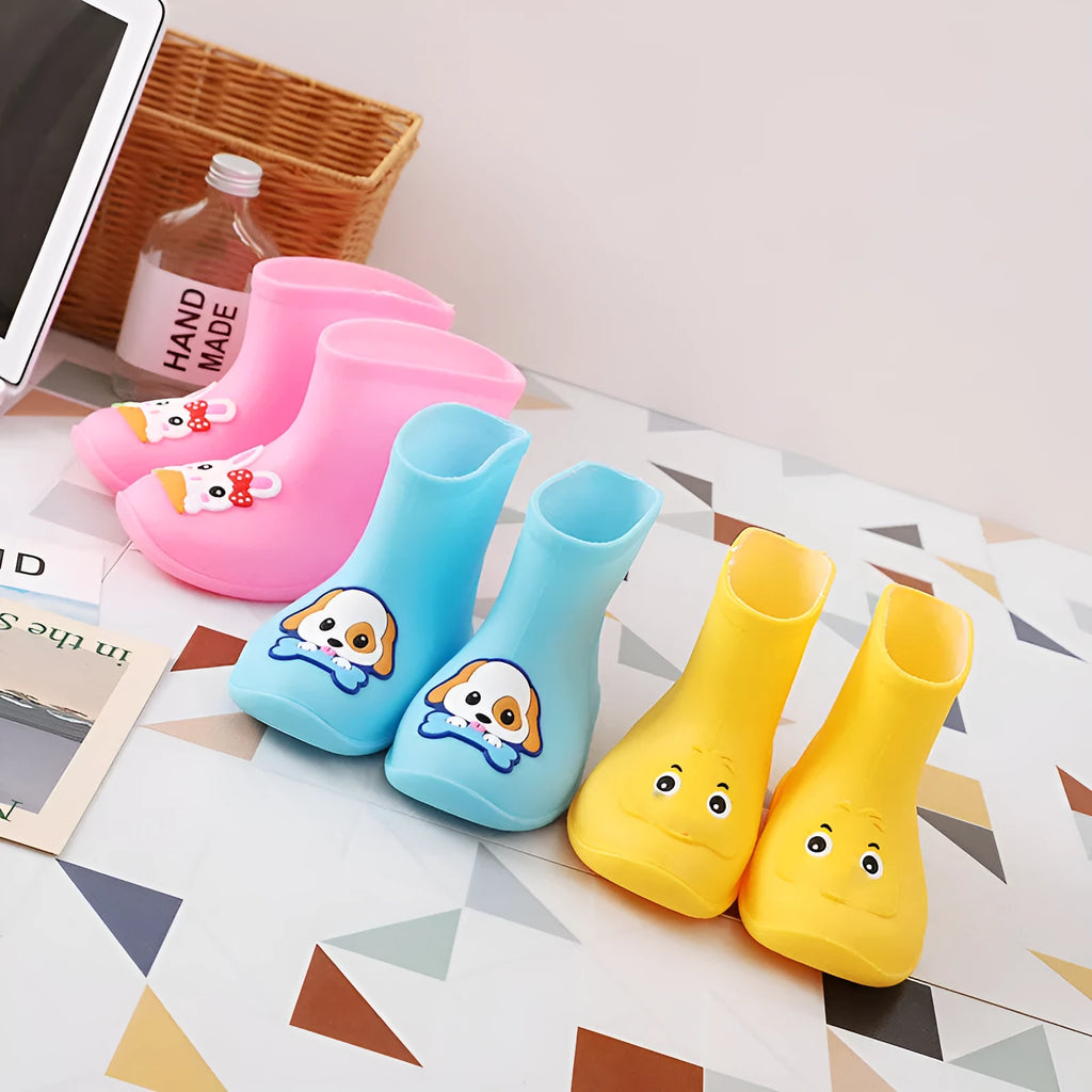 Children's short rain boots in yellow, pink, or blue with non-slip sole, waterproof PVC upper, cartoon pattern, sizes 14-18