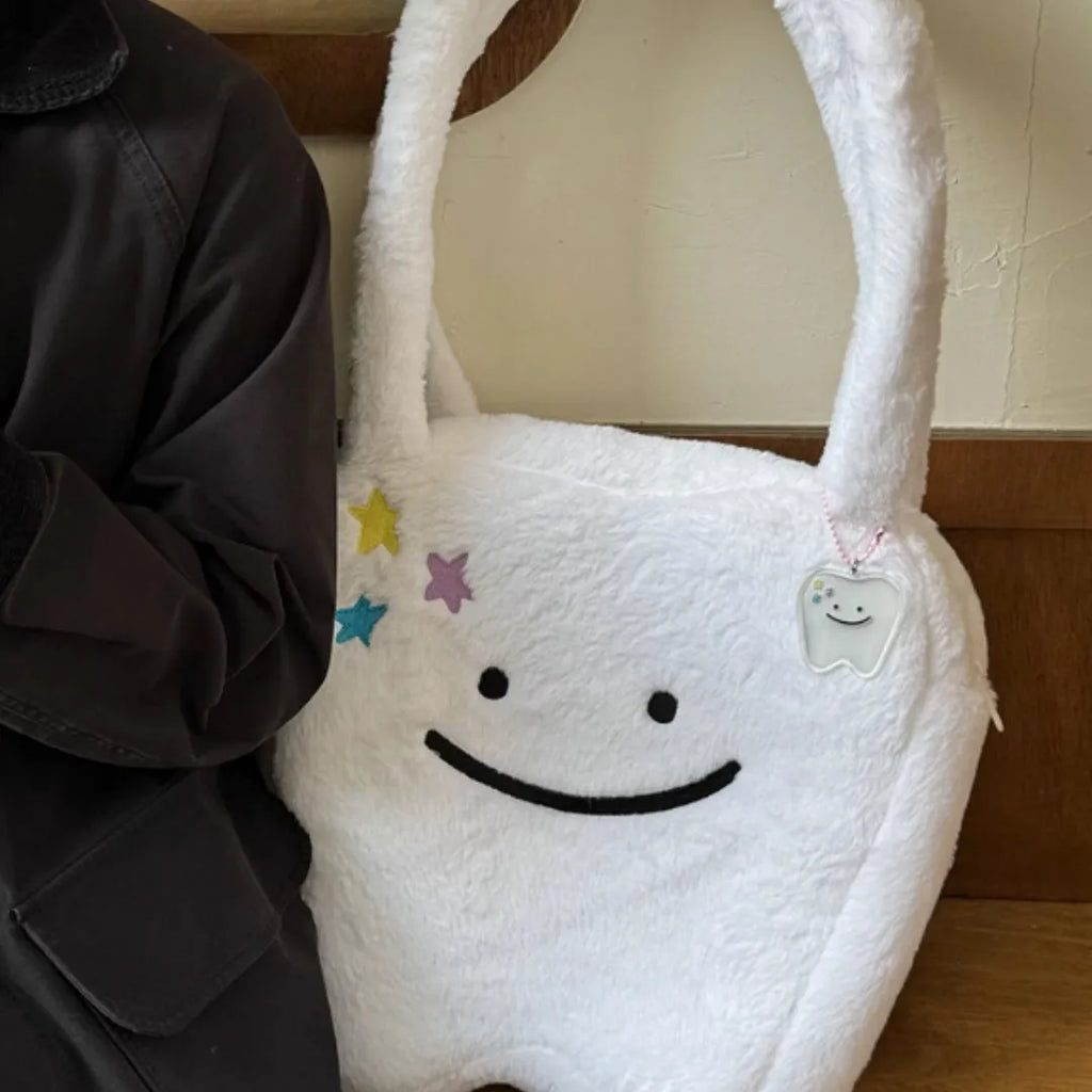 White plush shoulder tote bag with cute teeth design and zip opening