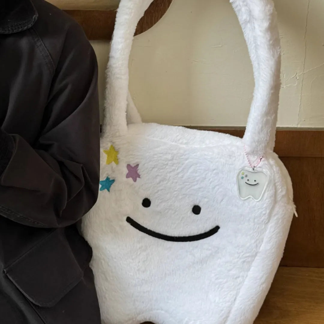 White plush shoulder tote bag with cute teeth design and zip opening