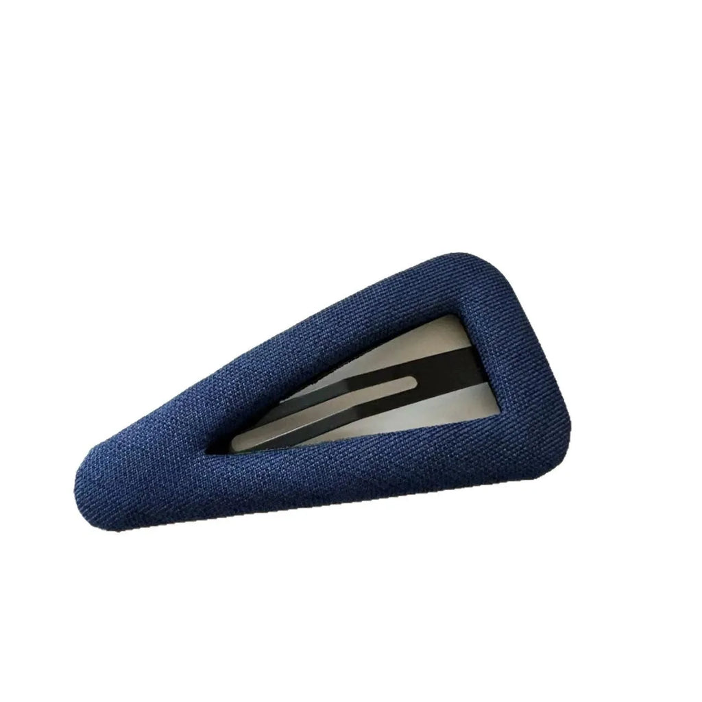 French retro style hair barrettes in triangle and water drop shapes with dark denim and polka dot patterns.