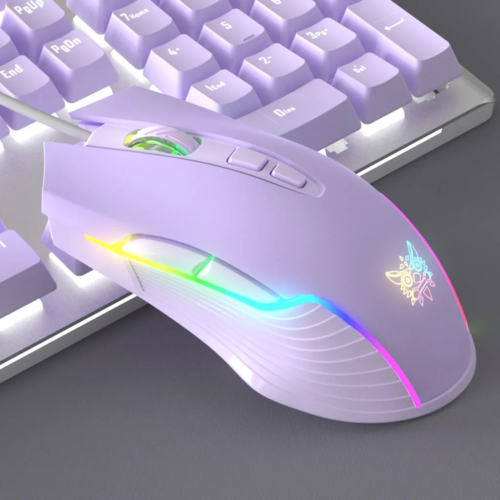 Purple and white mechanical keyboard and optical mouse set with backlighting on desktop