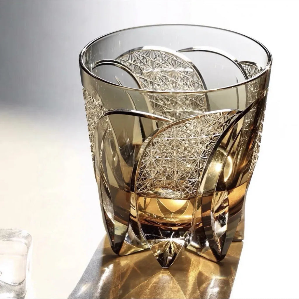 Amber gray crystal glass wine glass with rainbow effect on table, single retro cup
