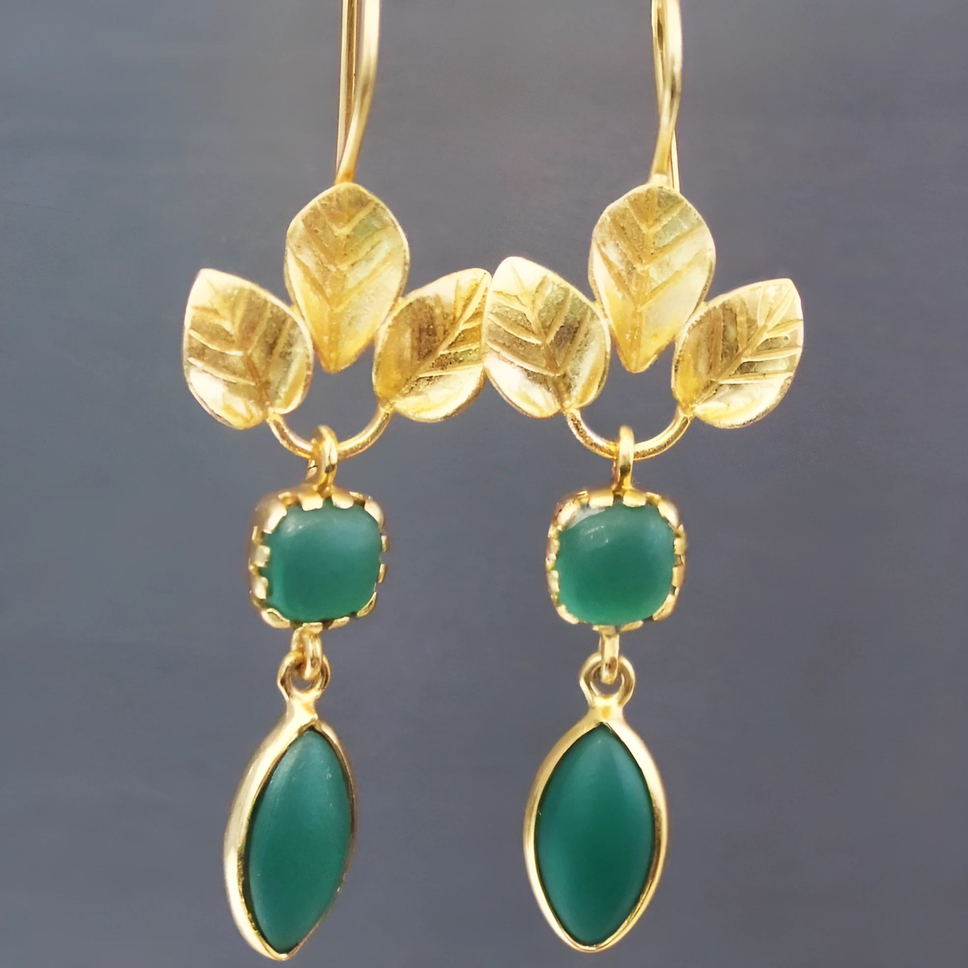 Gold-coloured retro drop earrings with French leaves, tassel, and water droplet design on a copper base.