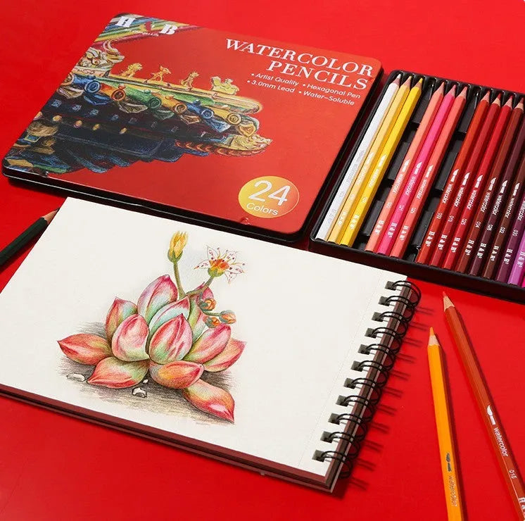 Water-soluble coloured pencil set with brush in an open iron storage tin, showing 24 wooden pencils.