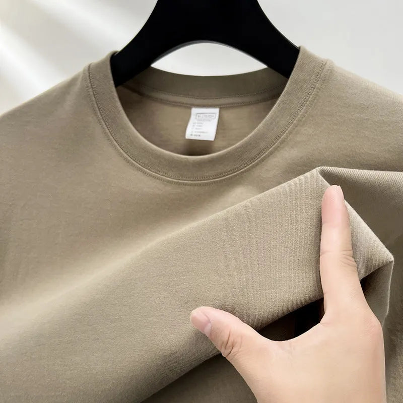 Men's thin cotton t-shirt with drop shoulder design in solid colour options like beige, sky blue, and pitaya