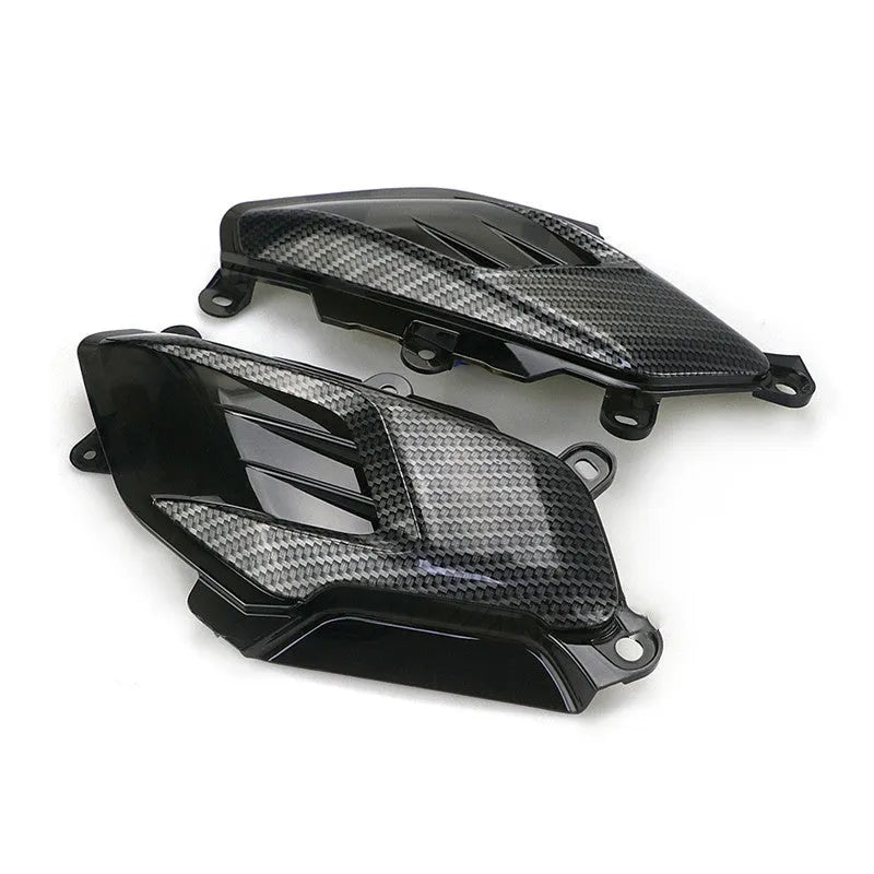 Pair of Yamaha NMAX aftermarket LED side lamps with carbon fibre decal on ABS shell.