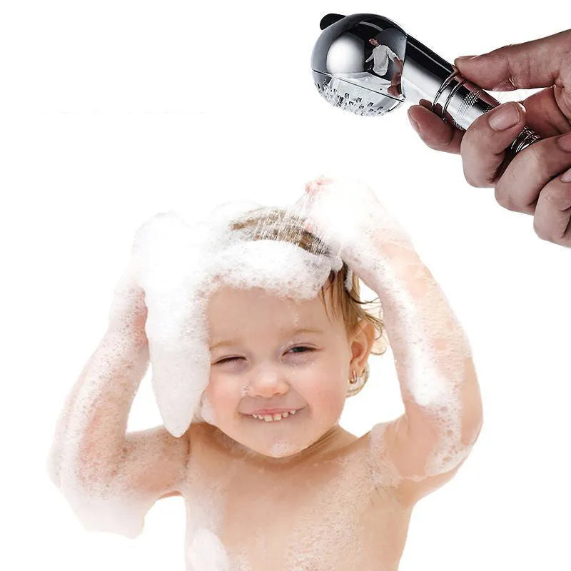 Silver handheld shower head for gentle pet and baby bathing without pressure.