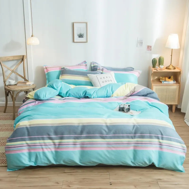 Cotton duvet cover and fitted sheet bedding set in a colour option, shown on a bed