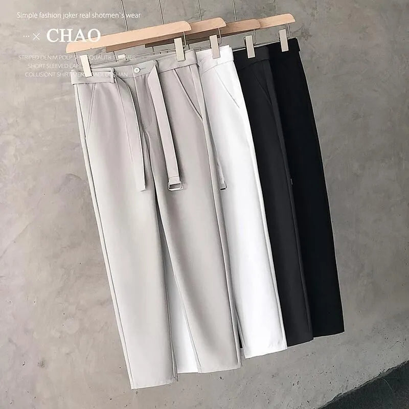 Boys slim straight wool trousers in tapered fit, shown in light grey colour.