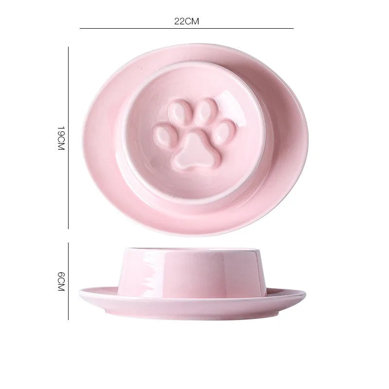 Green ceramic slow feed pet bowl with raised interior ridges and a non-slip black rubber base.