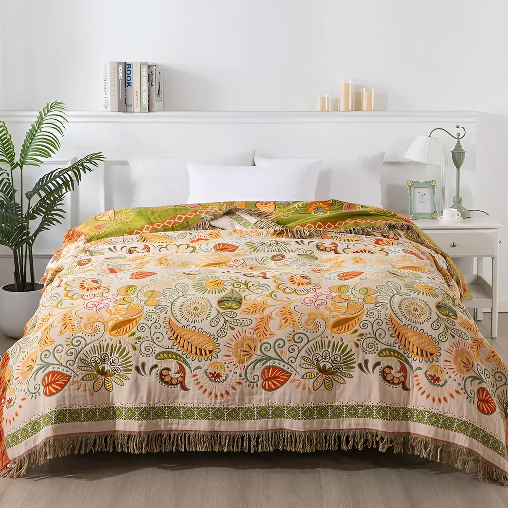 Cotton gauze towel blanket with tassel edging in neoclassical floral pattern, available in 150x200cm and 200x230cm.