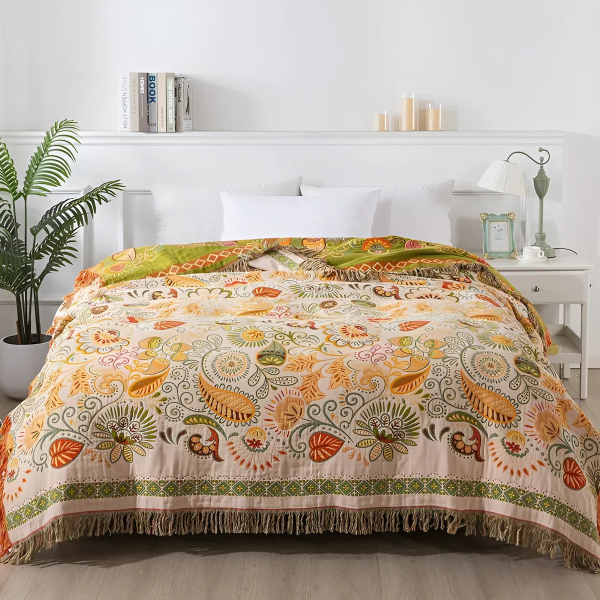 Cotton gauze towel blanket with tassel edging in neoclassical floral pattern, available in 150x200cm and 200x230cm.
