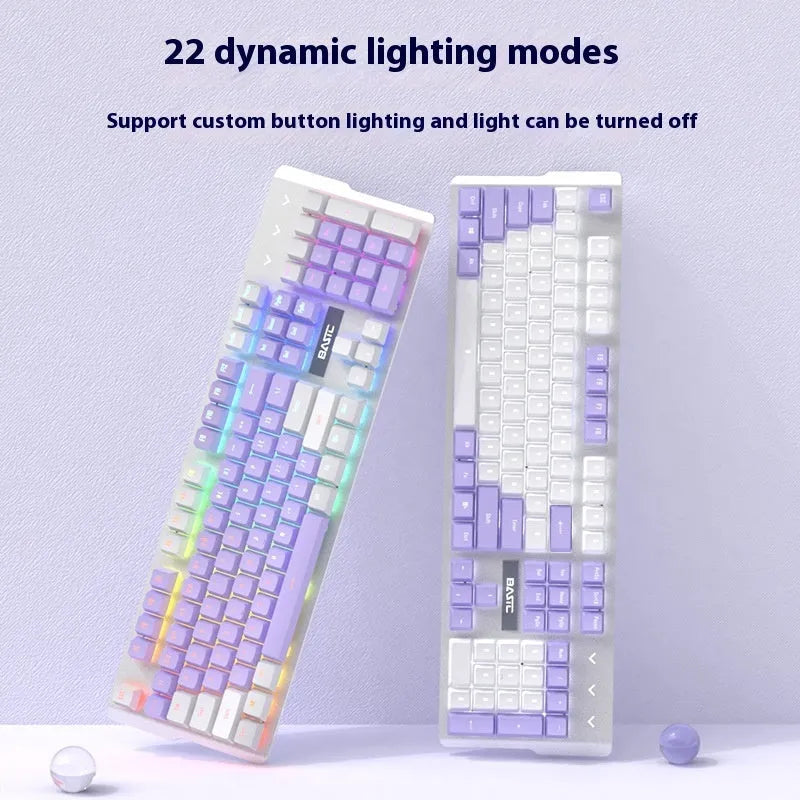 Purple and white mechanical keyboard and optical mouse set with backlighting on desktop