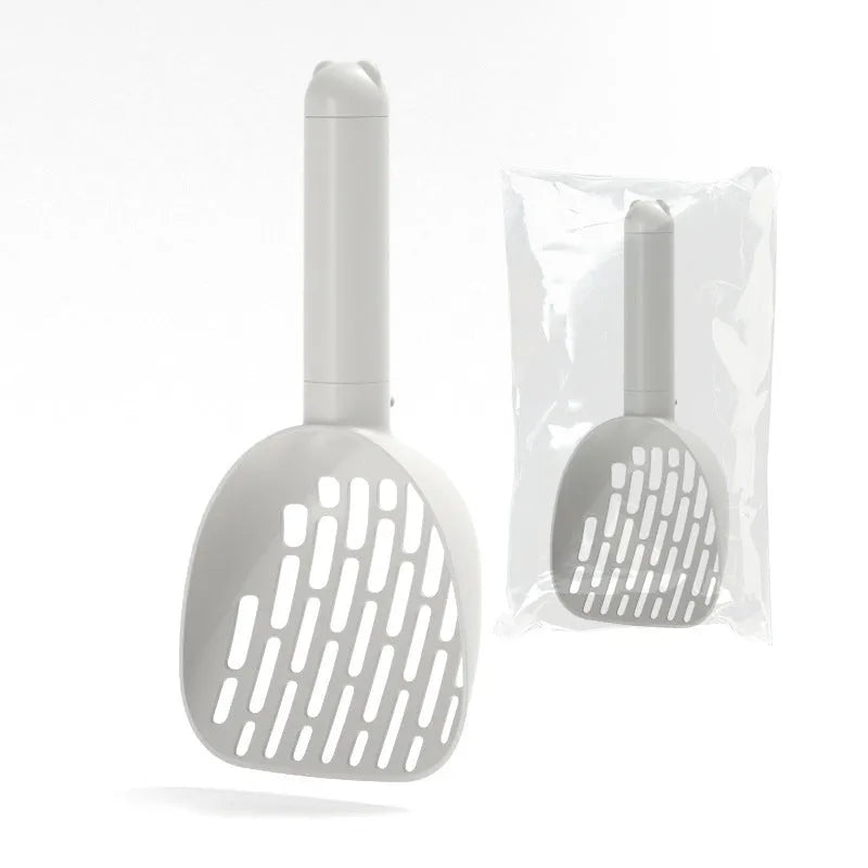 White ABS plastic cat litter scoop with a stand-up base and hidden bag storage compartment.