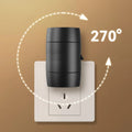Small white plug-in night lamp with adjustable dial and rotatable light head on a grey background.