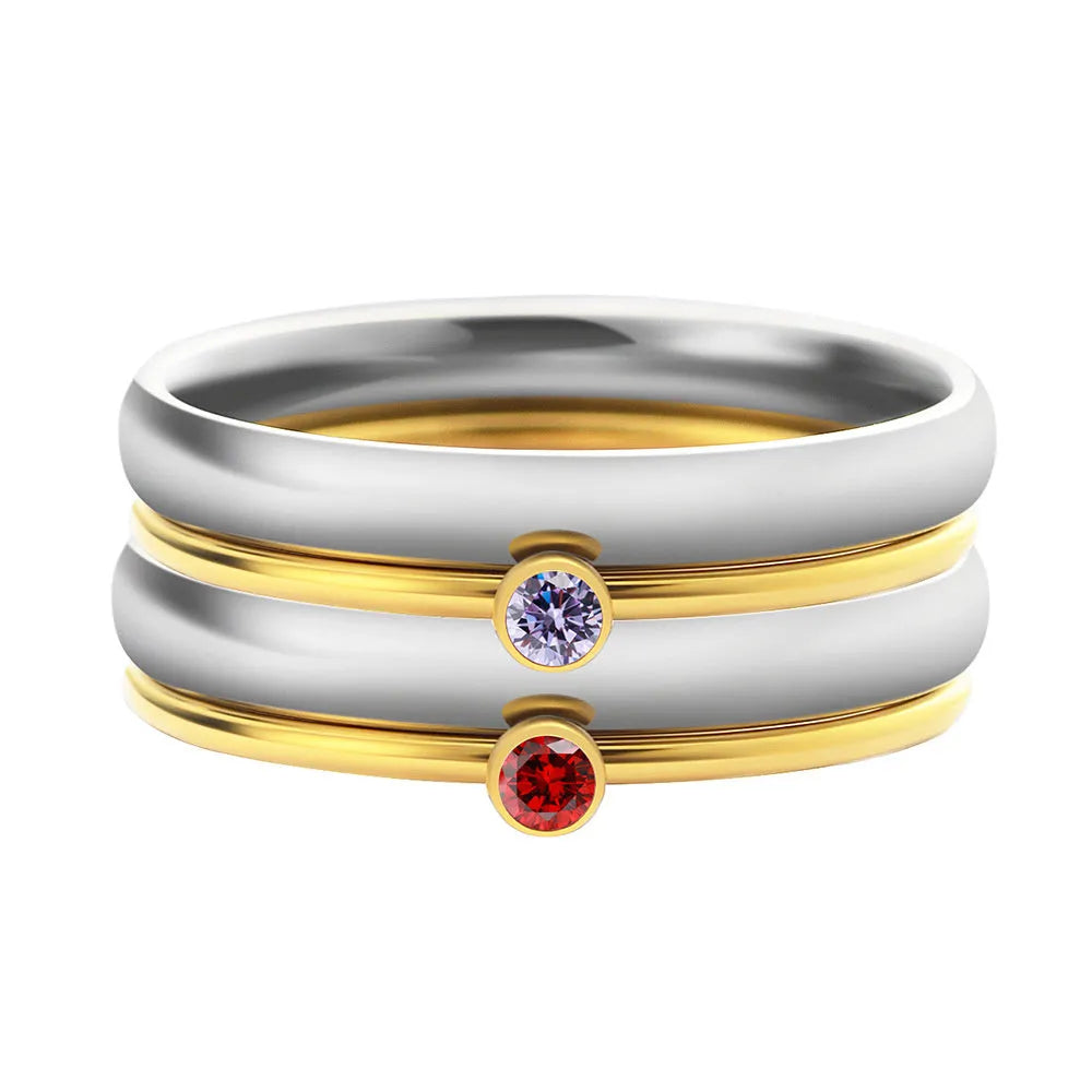 A geometric titanium steel ring with engraved details and a December birthstone colour accent.