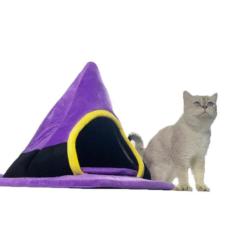 Purple cloth witch hat-shaped cat nest bed for pets, showing its wide brim and cosy interior.