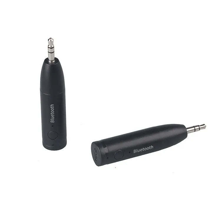 Black AUX Bluetooth 5.0 audio receiver for car or home stereo with USB cable.