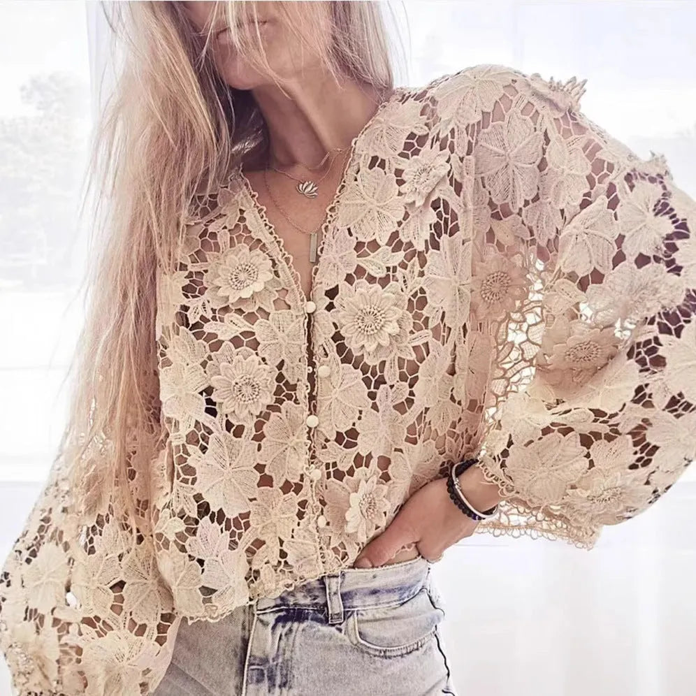 Black loose fit lace cardigan with V-neck and 3D floral decoration on a hanger