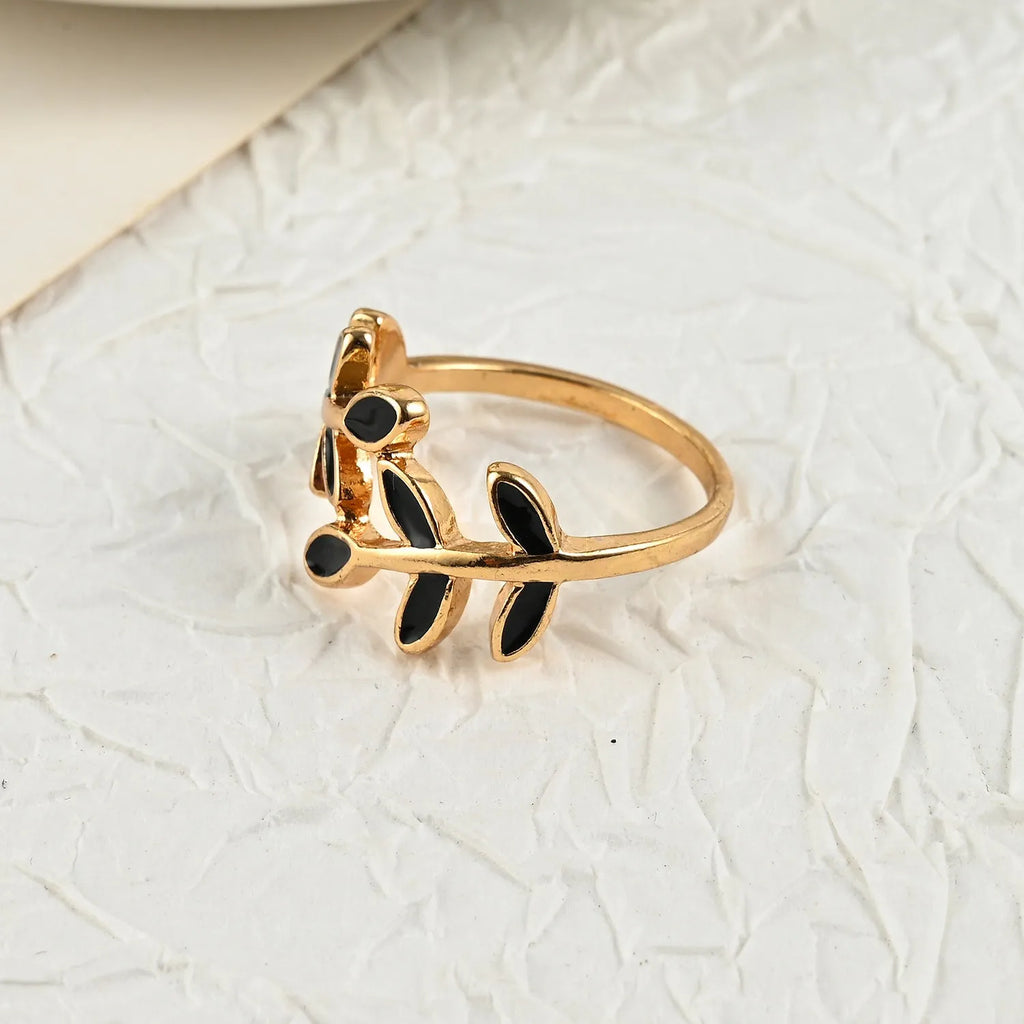Gold geometric leaf design finger ring with floral elements and electroplated finish