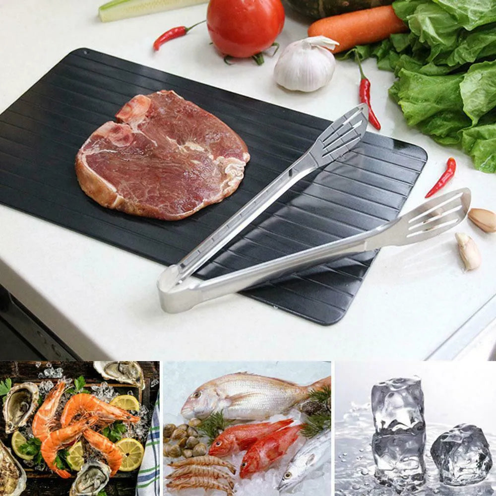 Black aluminium fast defrost tray for thawing frozen food on a kitchen counter.