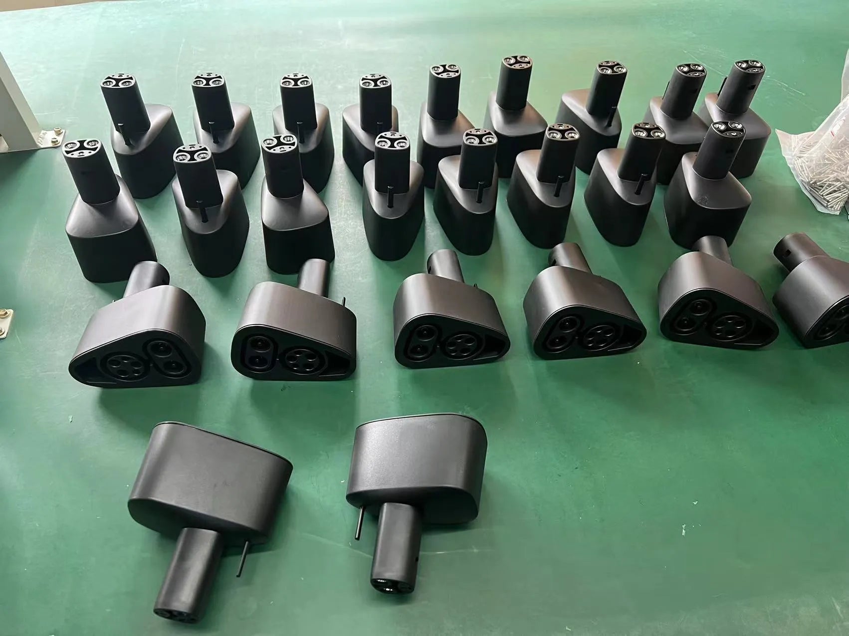 Black Tesla charging adaptor converting Type 2 connector to Tesla vehicle interface