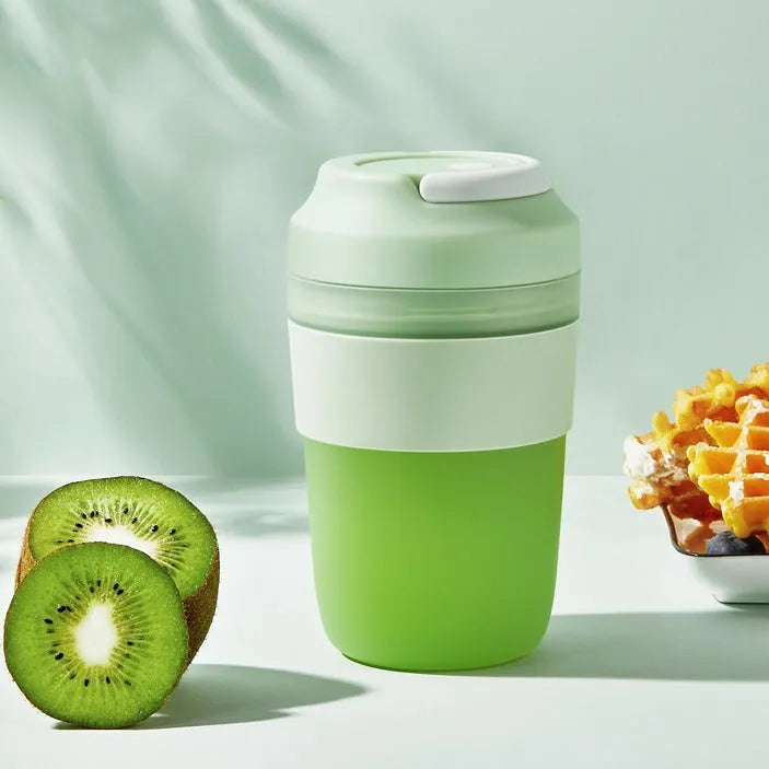 Portable purple blender cup with four stainless steel blades and a USB charging cable
