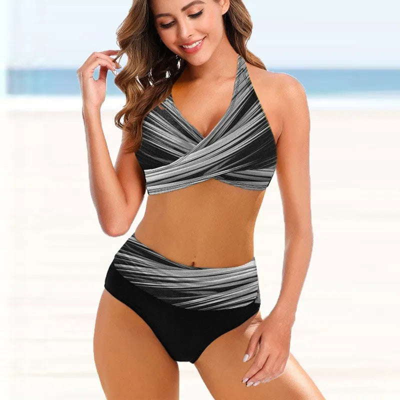 Woman wearing a striped tie-dye bikini with a hollow back and high-waisted briefs.