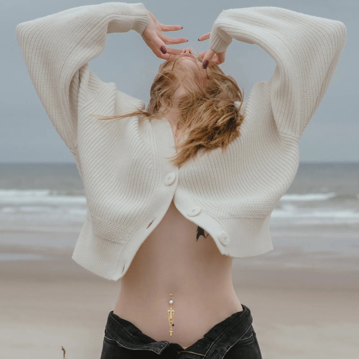 Gold cross navel piercing belly ring in stainless steel with a geometric unisex design