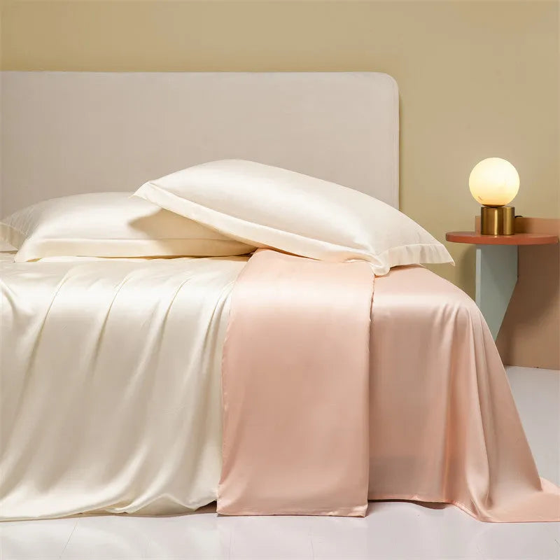 Luxury Tencel quilt cover and sheet set in Aurora Blue laid on a bed, showing deep pocket fitted sheet corner.