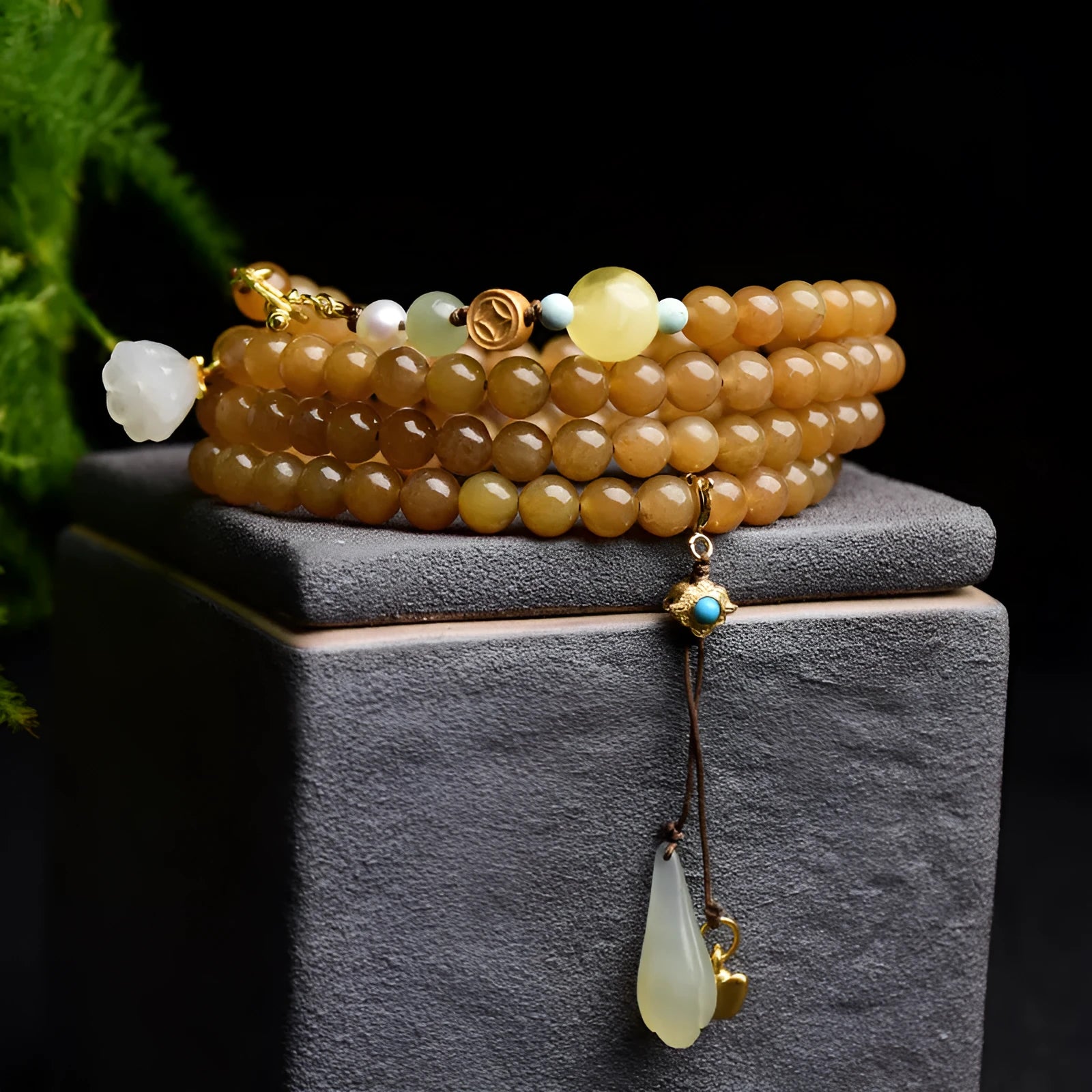 Green pine jade bracelet with 6mm round beads, leaf charms, and sequin accents on wrist