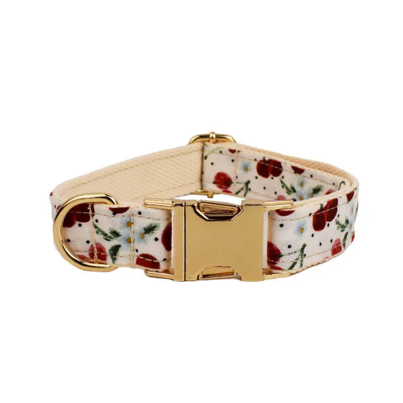 Red cherry print dog collar and leash set with light gold buckle and detachable bow strap