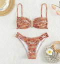 Women's high-waisted floral bikini swimsuit set in a solid colour with a briefs design.