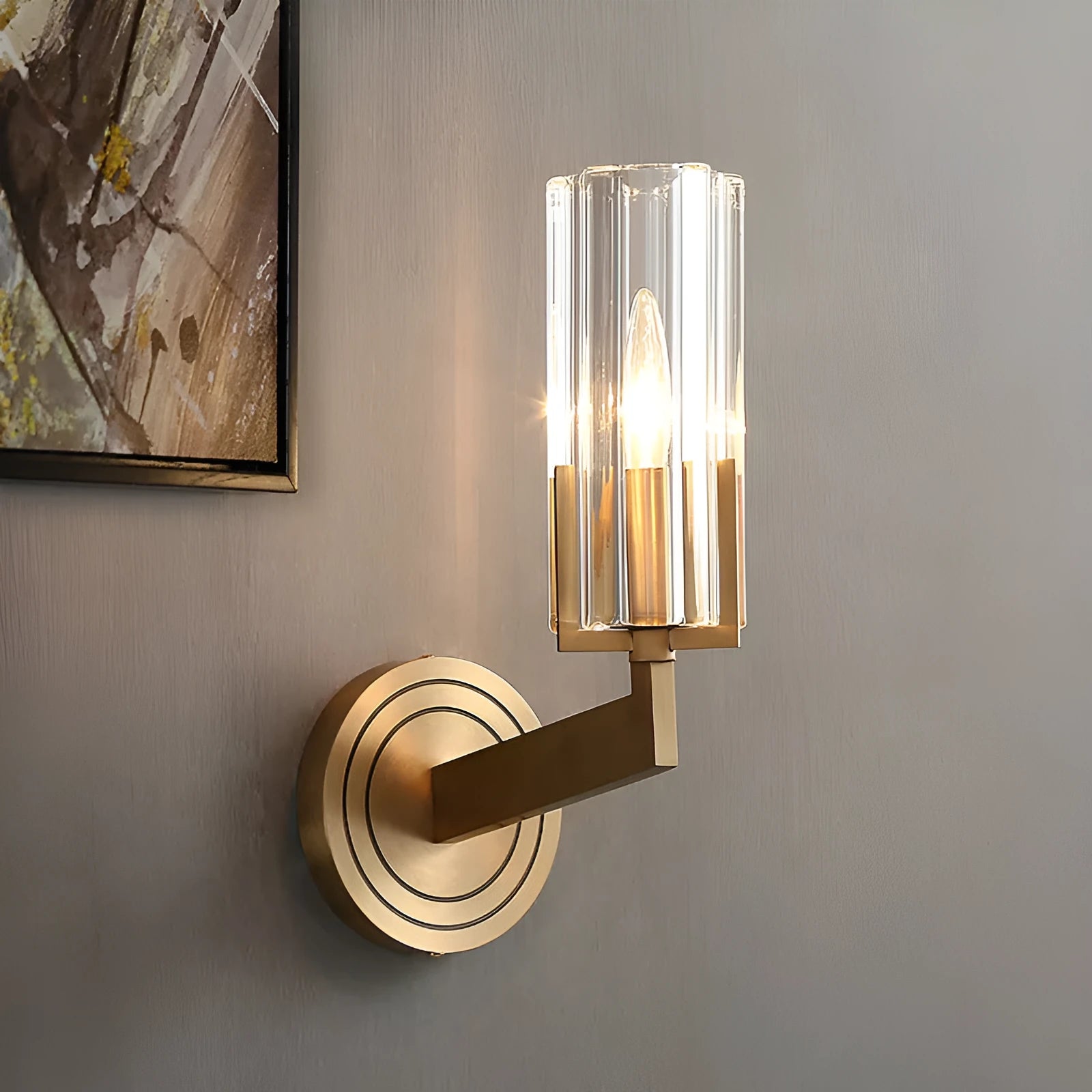 Modern minimalist copper wall lamp with single head on a white wall.