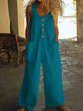 A sleeveless, wide-leg cotton jumpsuit in an art retro style, shown in Peacock Green colour with a visible pocket.