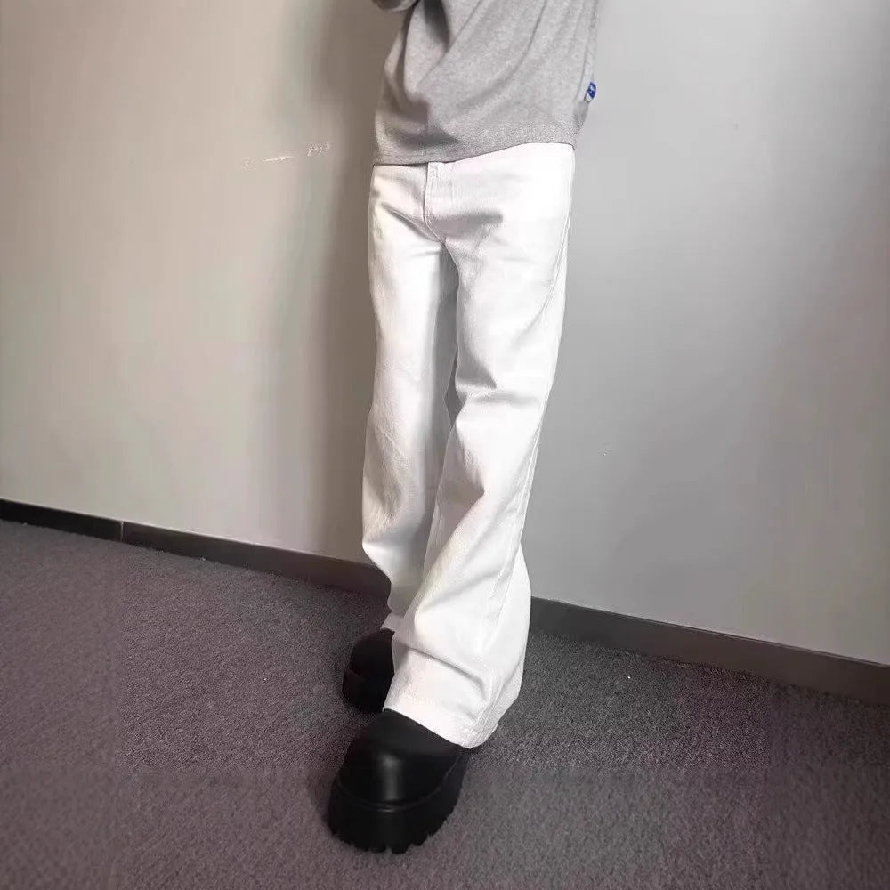 Men's white loose straight-leg wide-leg denim jeans on a mid-waist with a zipper fly.