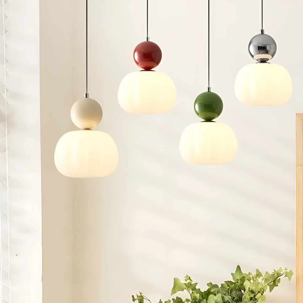 Nordic style pumpkin-shaped alloy chandelier hanging from a ceiling, available in single or three-head models.